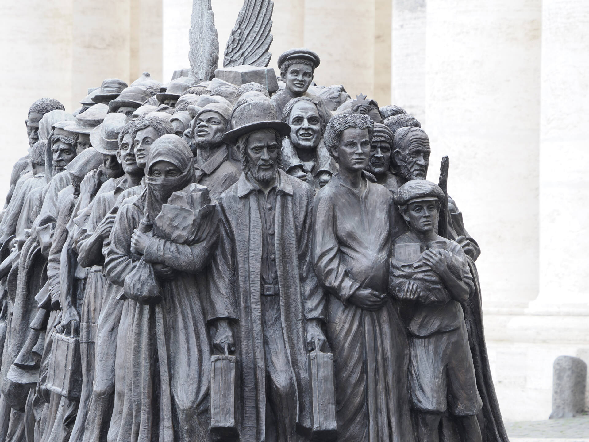 rome, italy november 25, 2022 : migrants monument sculpture in vatican place st. peter's square in rome